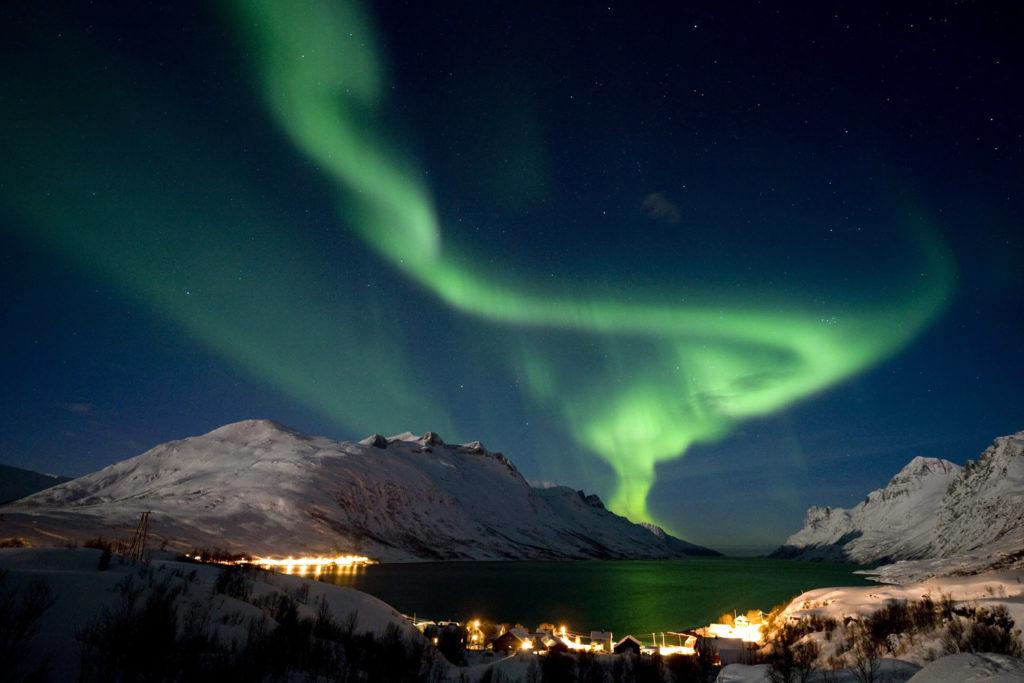 Image: The aurora borealis, or northern lights, are seen on the sky above the village of Ersfjordbotn near Tromso in northern Norway
